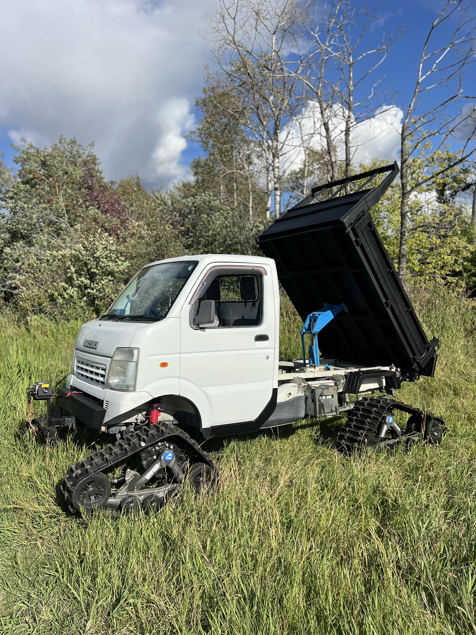 Tracked Suzuki dump truck